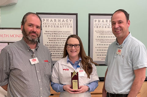 Pharmacy Weis Markets employee receiving an award.